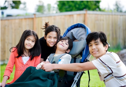 asian family hugging around a stroller